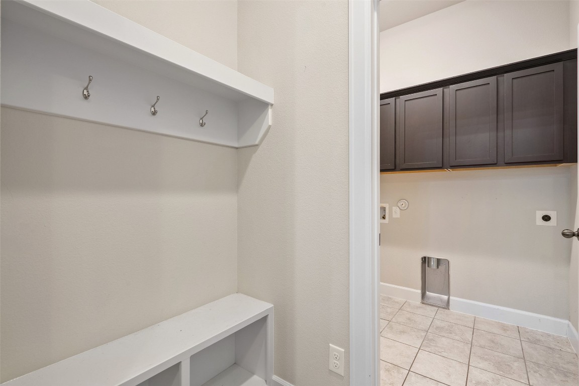 103 Lockhart Loop Georgetown, TX 78628 - Photo 9 of 40 Mudroom featuring baseboards and light tile patterned flooring