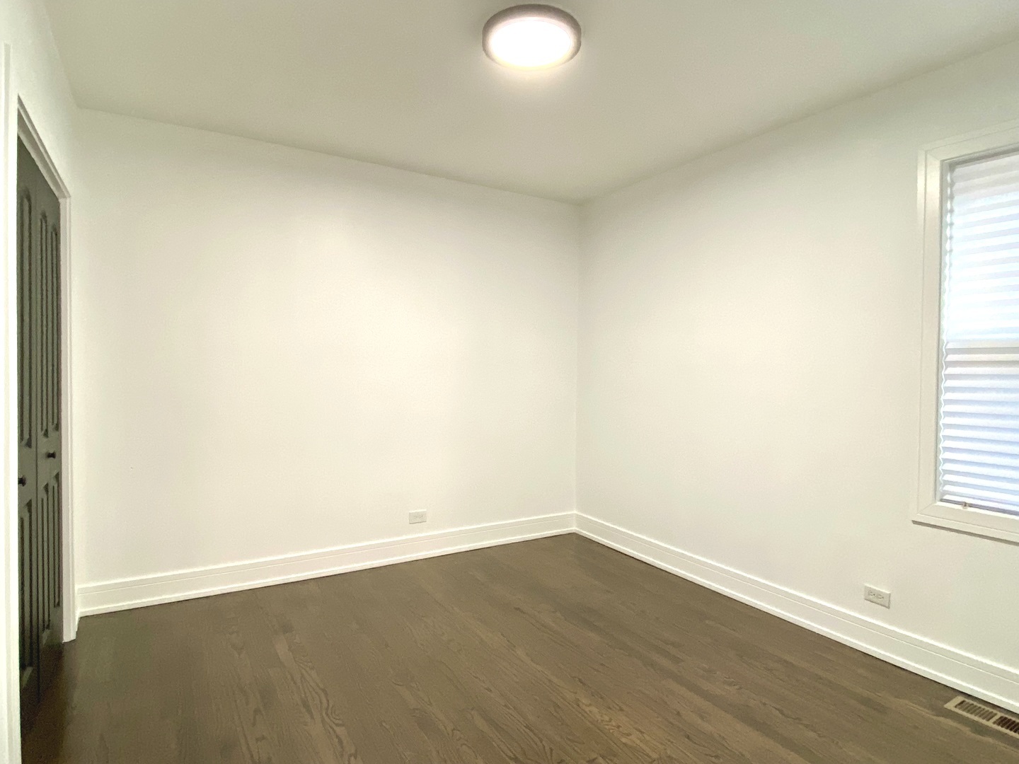 Undisclosed Address Chicago, IL 60619 - Photo 15 of 39 an empty room with wooden floor and windows