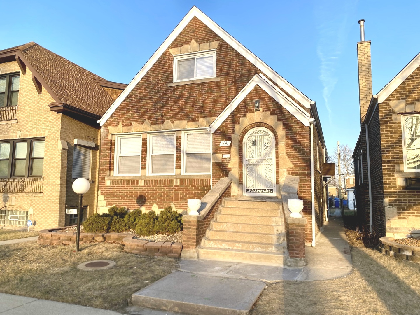 Undisclosed Address Chicago, IL 60619 - Photo 2 of 39 a view of a brick house with large windows