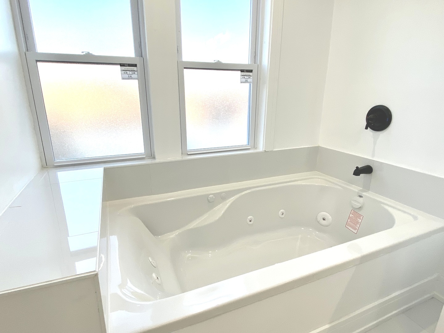 Undisclosed Address Chicago, IL 60619 - Photo 27 of 39 a bathroom with a tub and a window