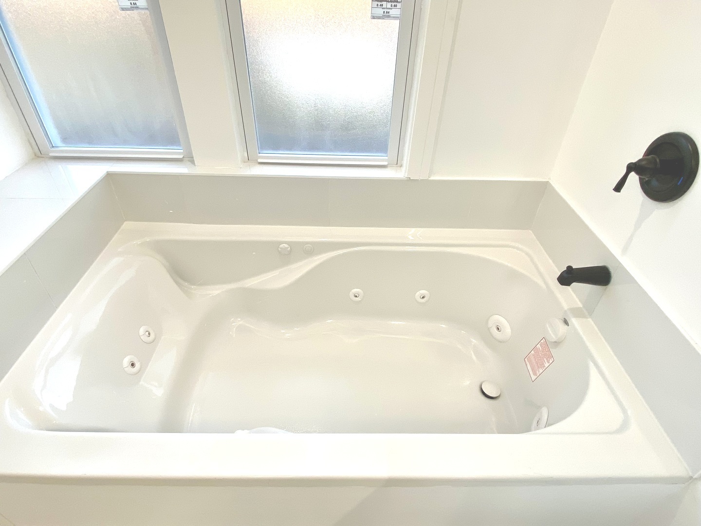 Undisclosed Address Chicago, IL 60619 - Photo 28 of 39 a bath tub sitting next to a window