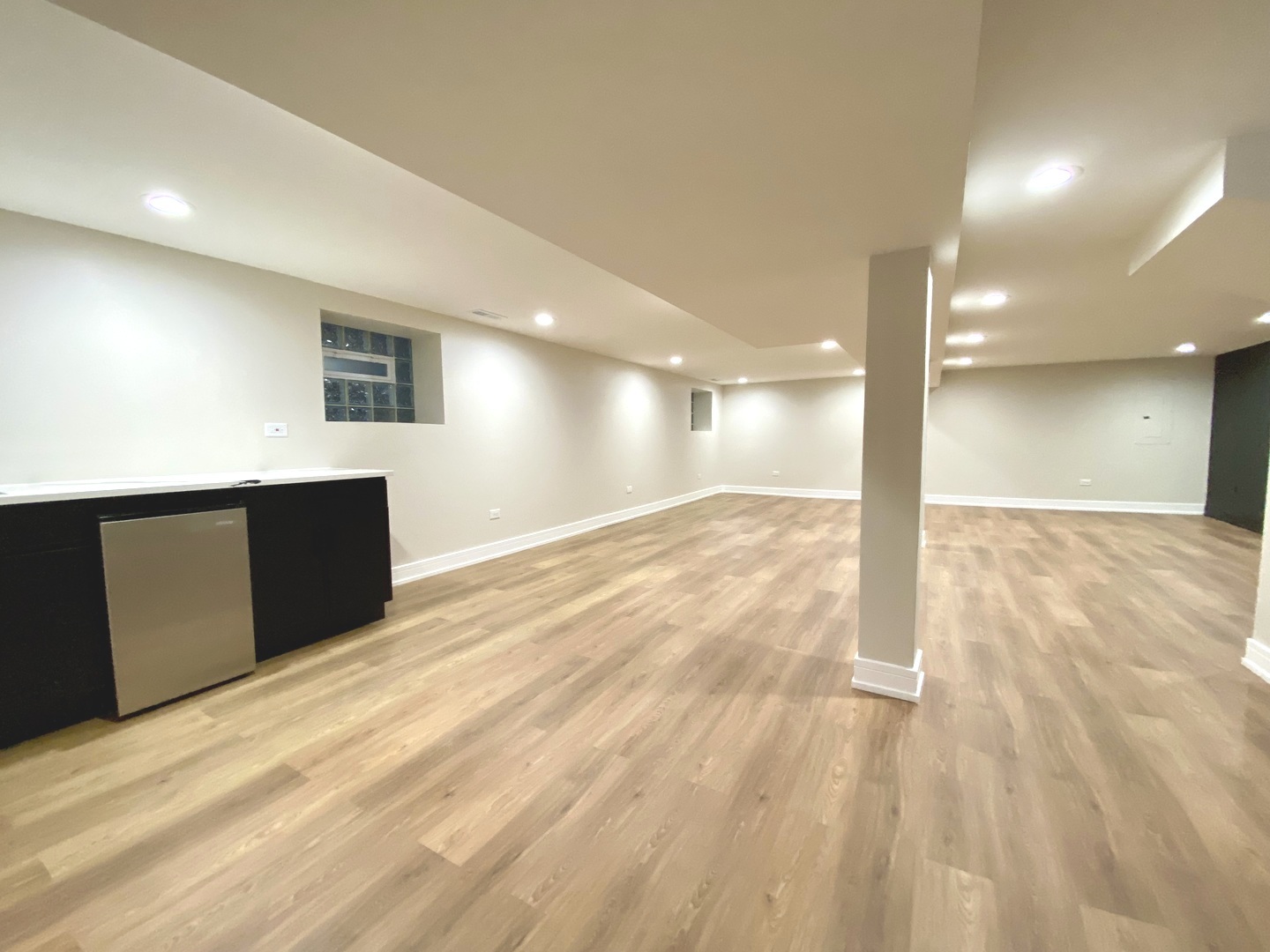 Undisclosed Address Chicago, IL 60619 - Photo 30 of 39 a view of a big room with wooden floor and windows