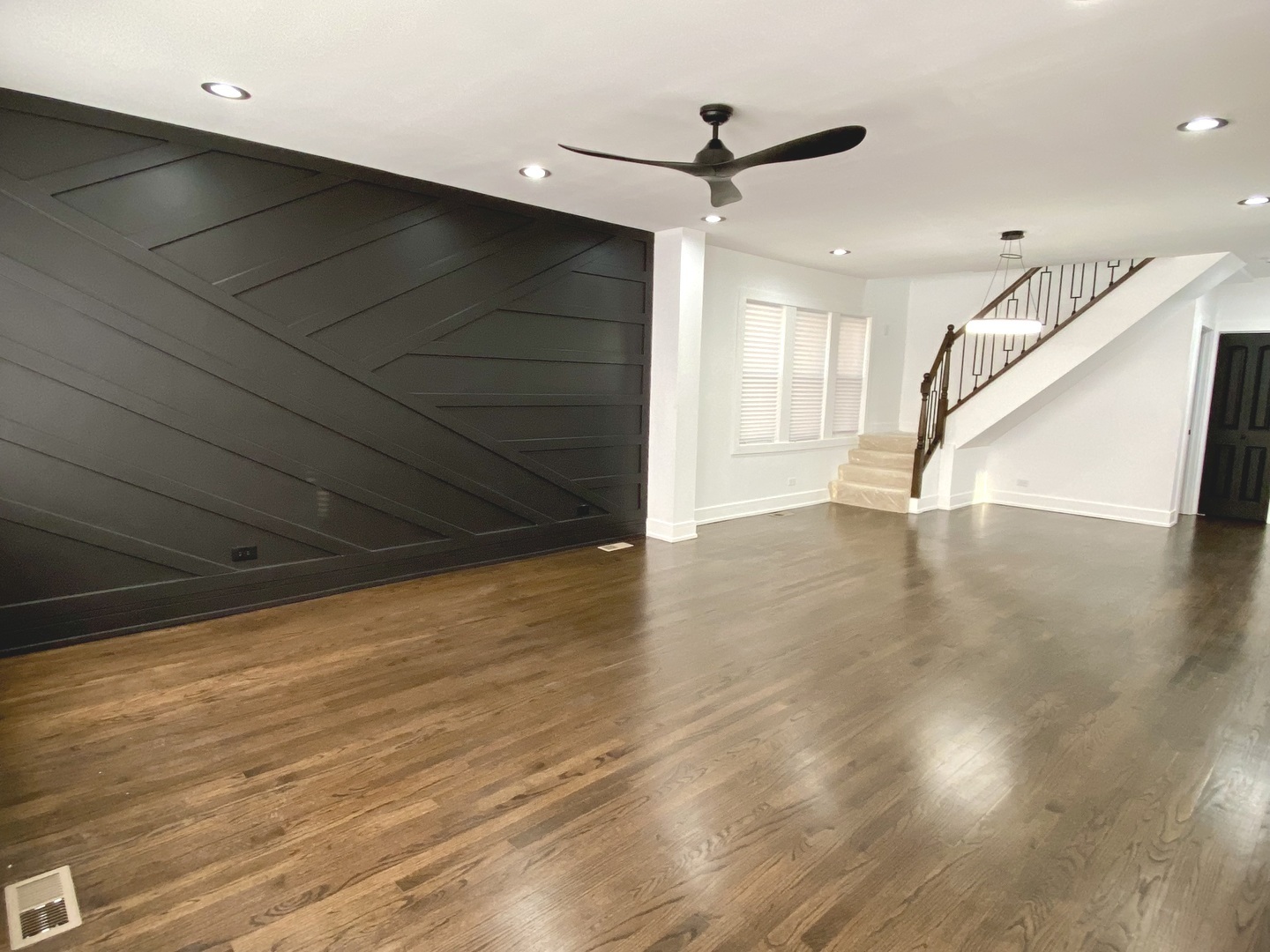 Undisclosed Address Chicago, IL 60619 - Photo 3 of 39 a view of an empty room with wooden floor and a window