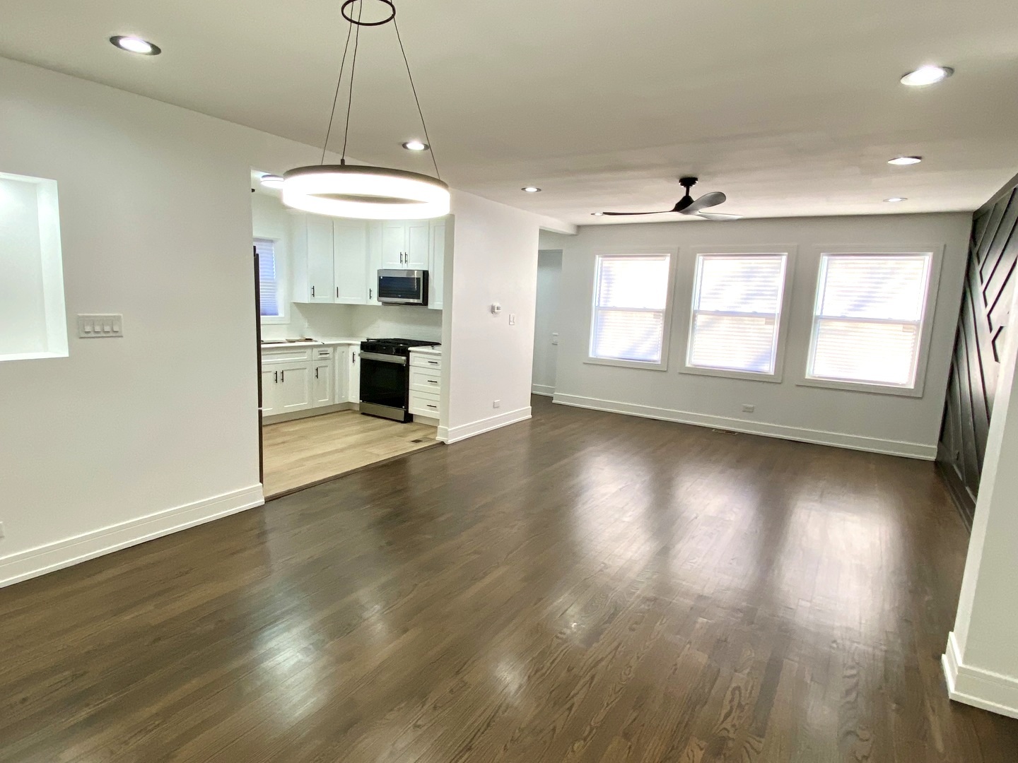 Undisclosed Address Chicago, IL 60619 - Photo 6 of 39 an open kitchen with window and wooden floor