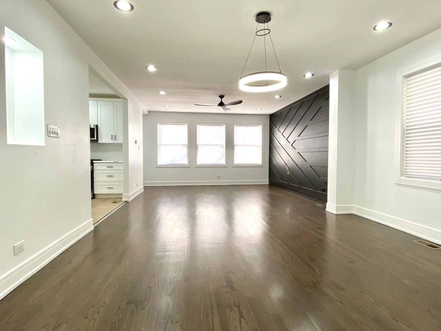 Undisclosed Address Chicago, IL 60619 - Photo 7 of 39 an empty room with wooden floor and windows