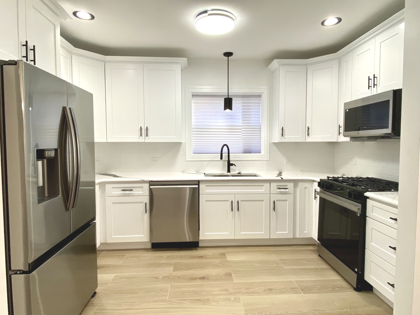 Undisclosed Address Chicago, IL 60619 - Photo 8 of 39 a kitchen with granite countertop a refrigerator stove and sink