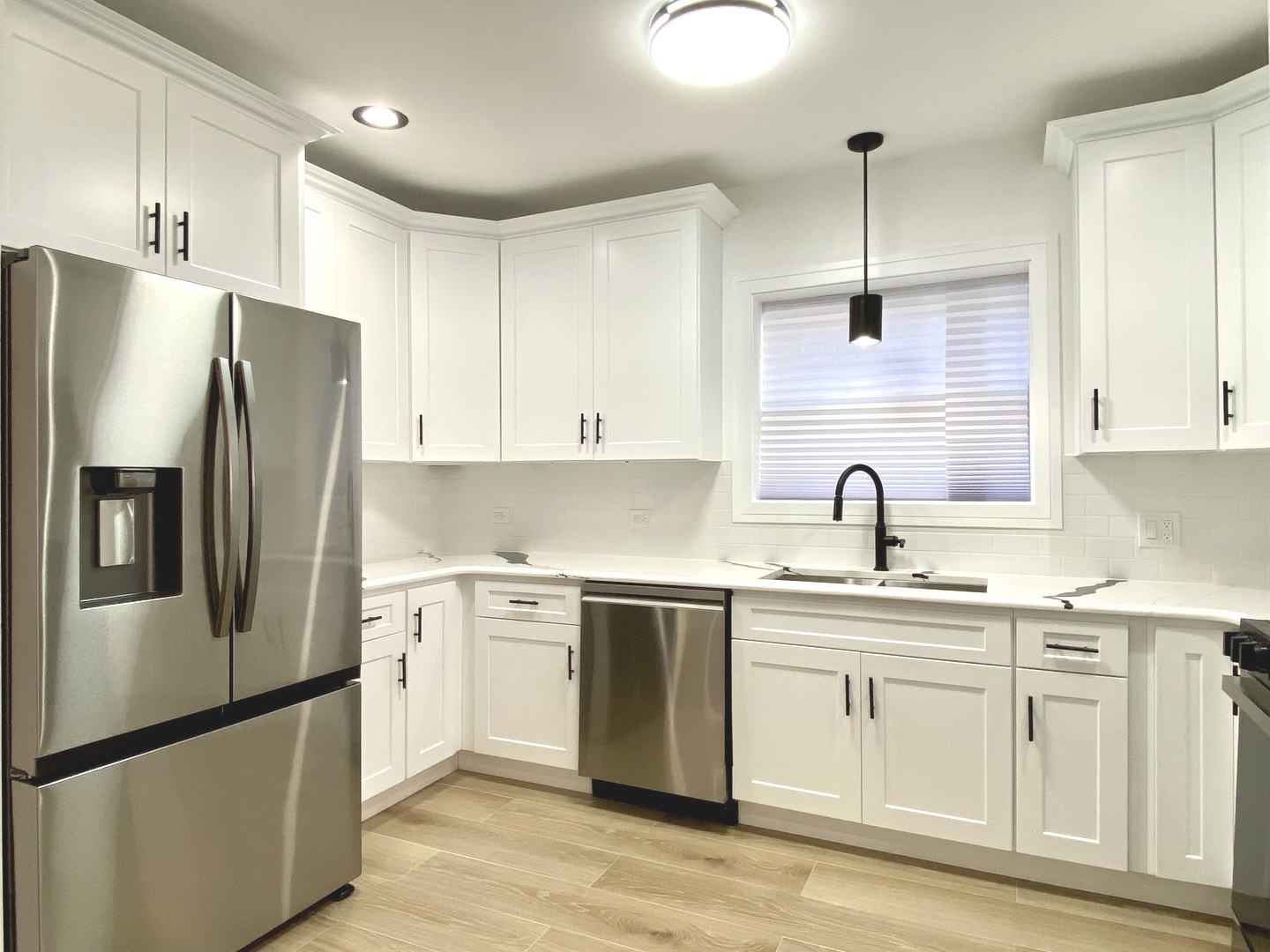 Undisclosed Address Chicago, IL 60619 - Photo 9 of 39 a kitchen with stainless steel appliances granite countertop a sink a refrigerator a center island and cabinets