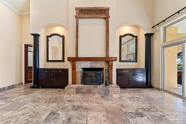 a kitchen with kitchen island granite countertop a sink and a stove top oven