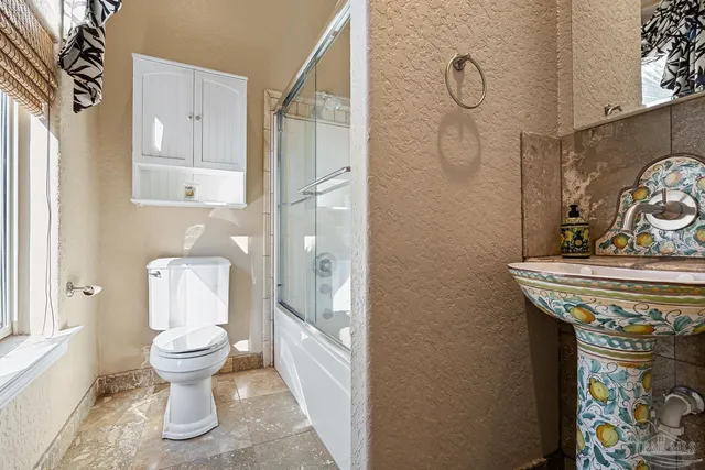 a view of a swimming pool with outdoor seating