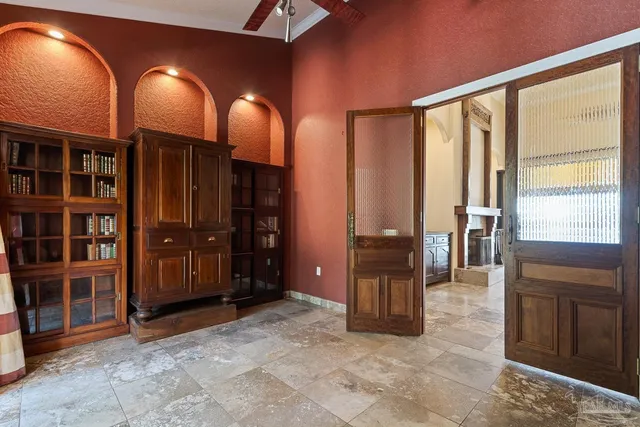 a swimming pool with outdoor seating and yard