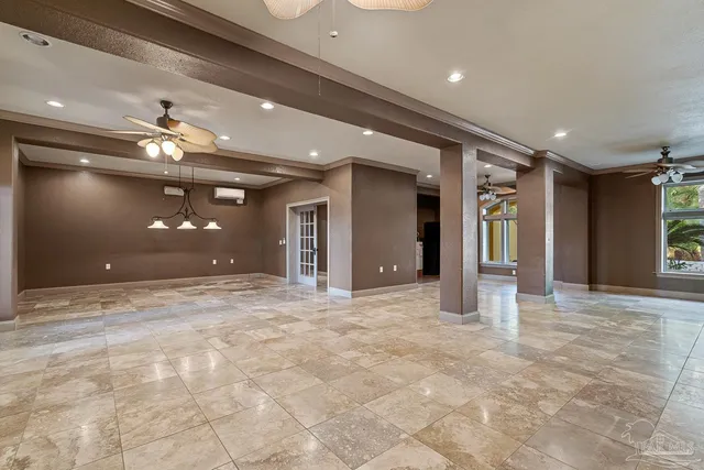a view of a balcony with chairs and wooden floor