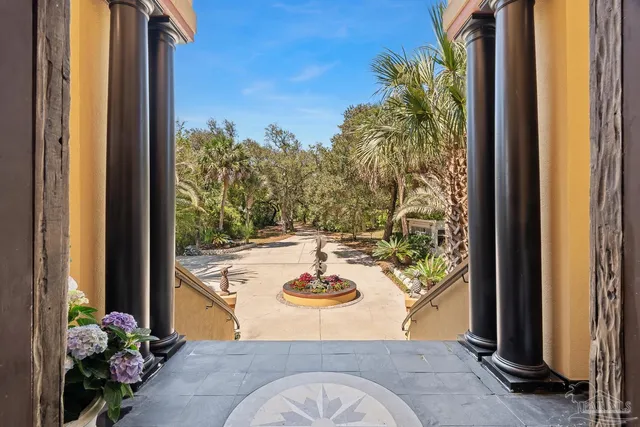 a view of an empty room with a fireplace and a window