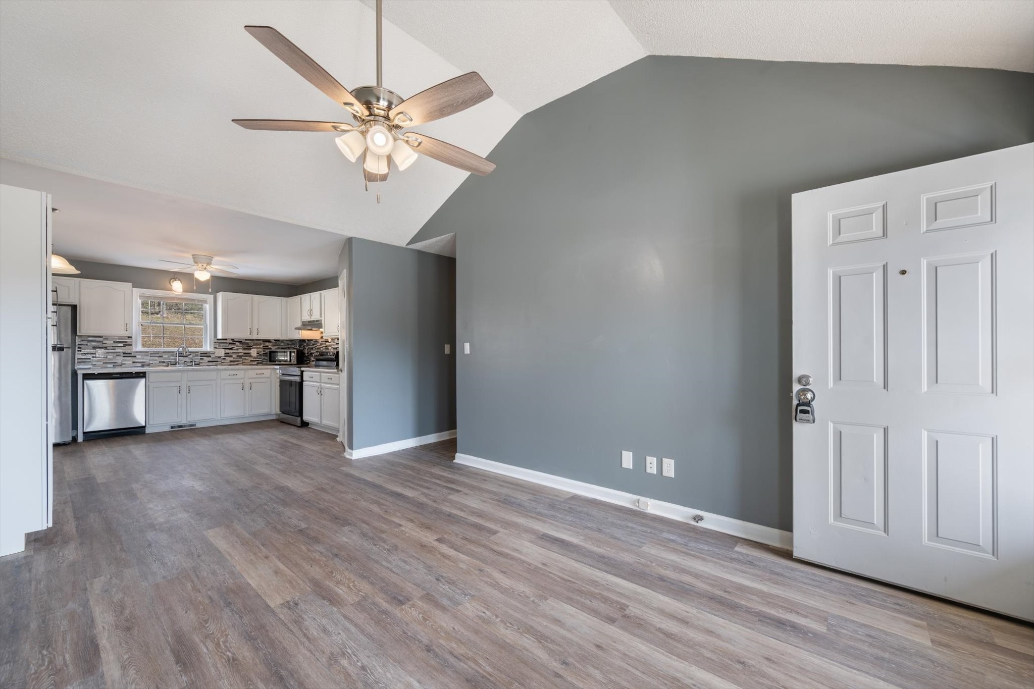 1007 Granny White Road Clarksville, TN 37040 - Photo 15 of 27 a view of a kitchen with a sink and a refrigerator