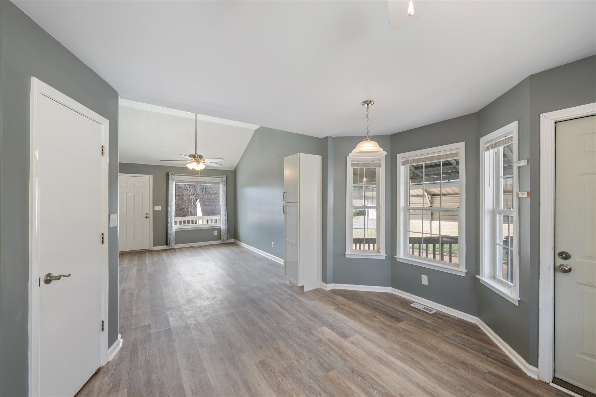 1007 Granny White Road Clarksville, TN 37040 - Photo 19 of 27 a view of an empty room with wooden floor and a window