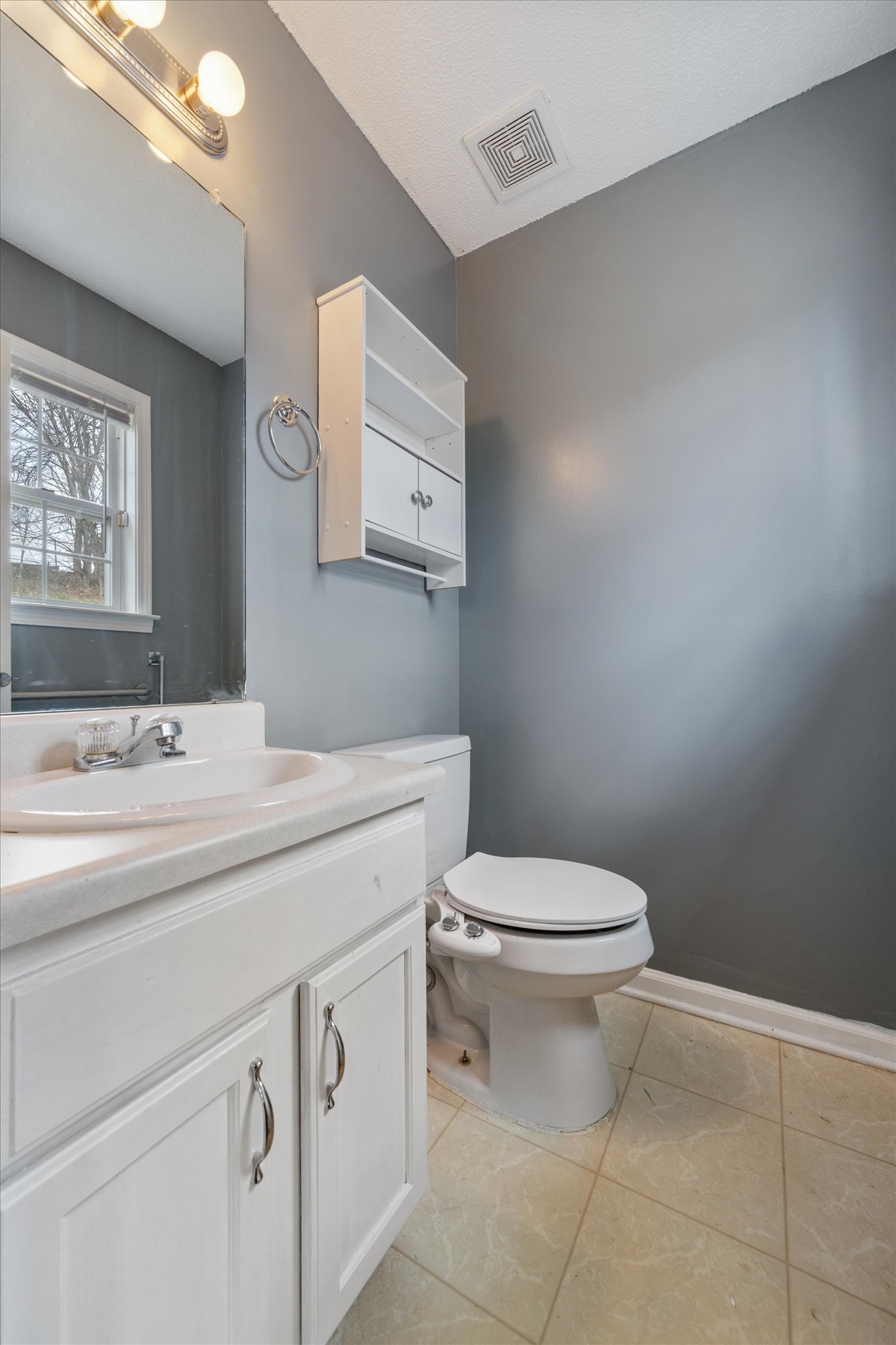 1007 Granny White Road Clarksville, TN 37040 - Photo 23 of 27 a bathroom with a toilet sink and mirror