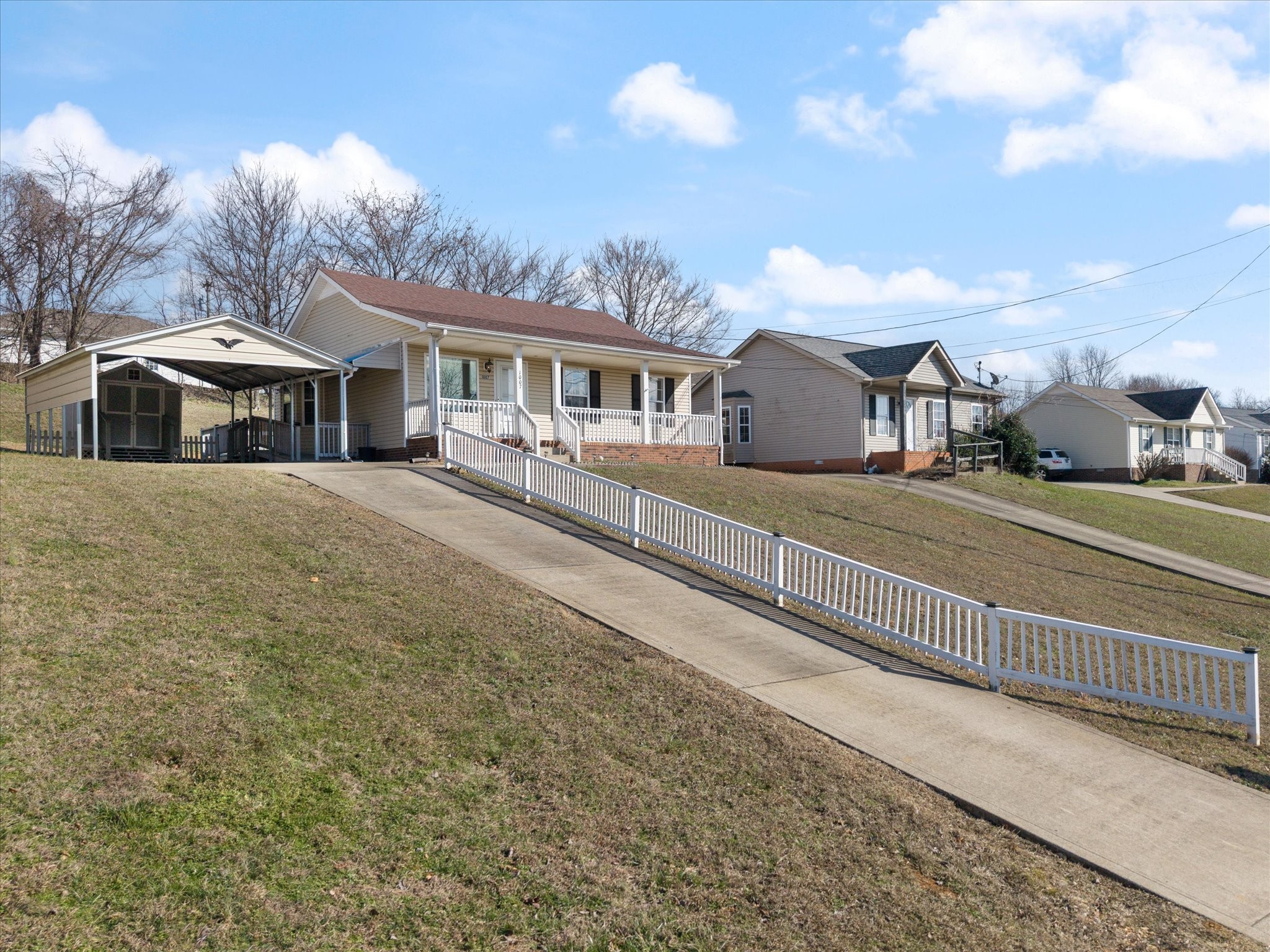 1007 Granny White Road Clarksville, TN 37040 - Photo 3 of 27 a front view of a house with a yard