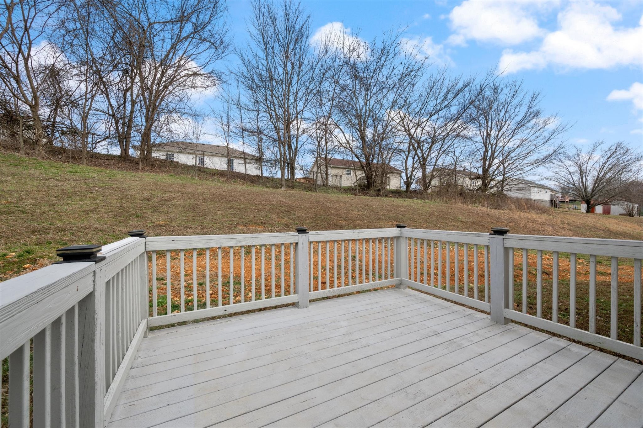 1007 Granny White Road Clarksville, TN 37040 - Photo 10 of 27 a balcony with wooden floor and fence