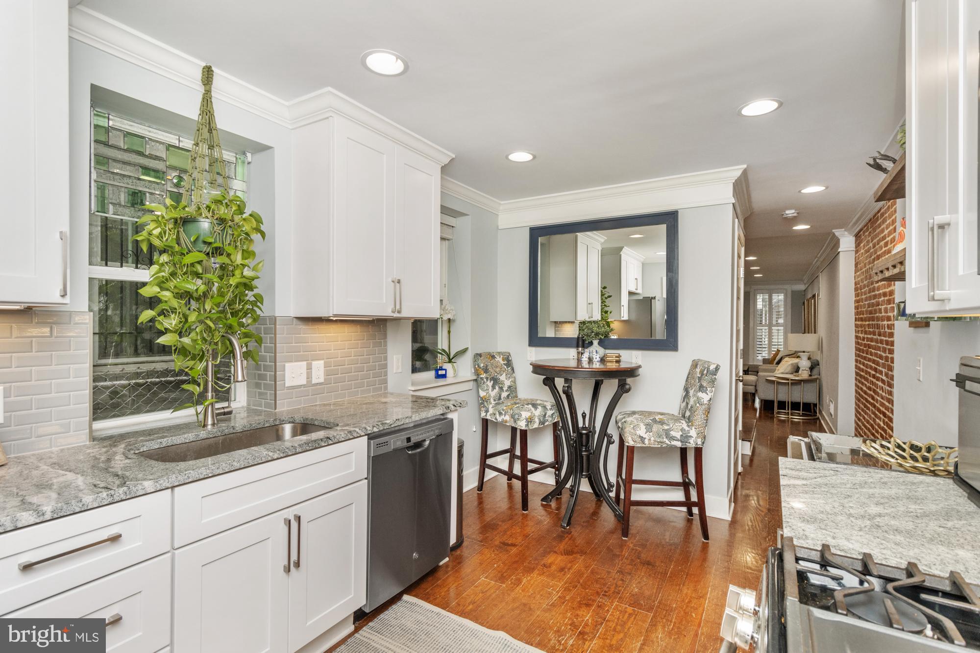 217 East Cross Street Baltimore, MD 21230 - Photo 12 of 50 a view of a kitchen with dining table and chairs