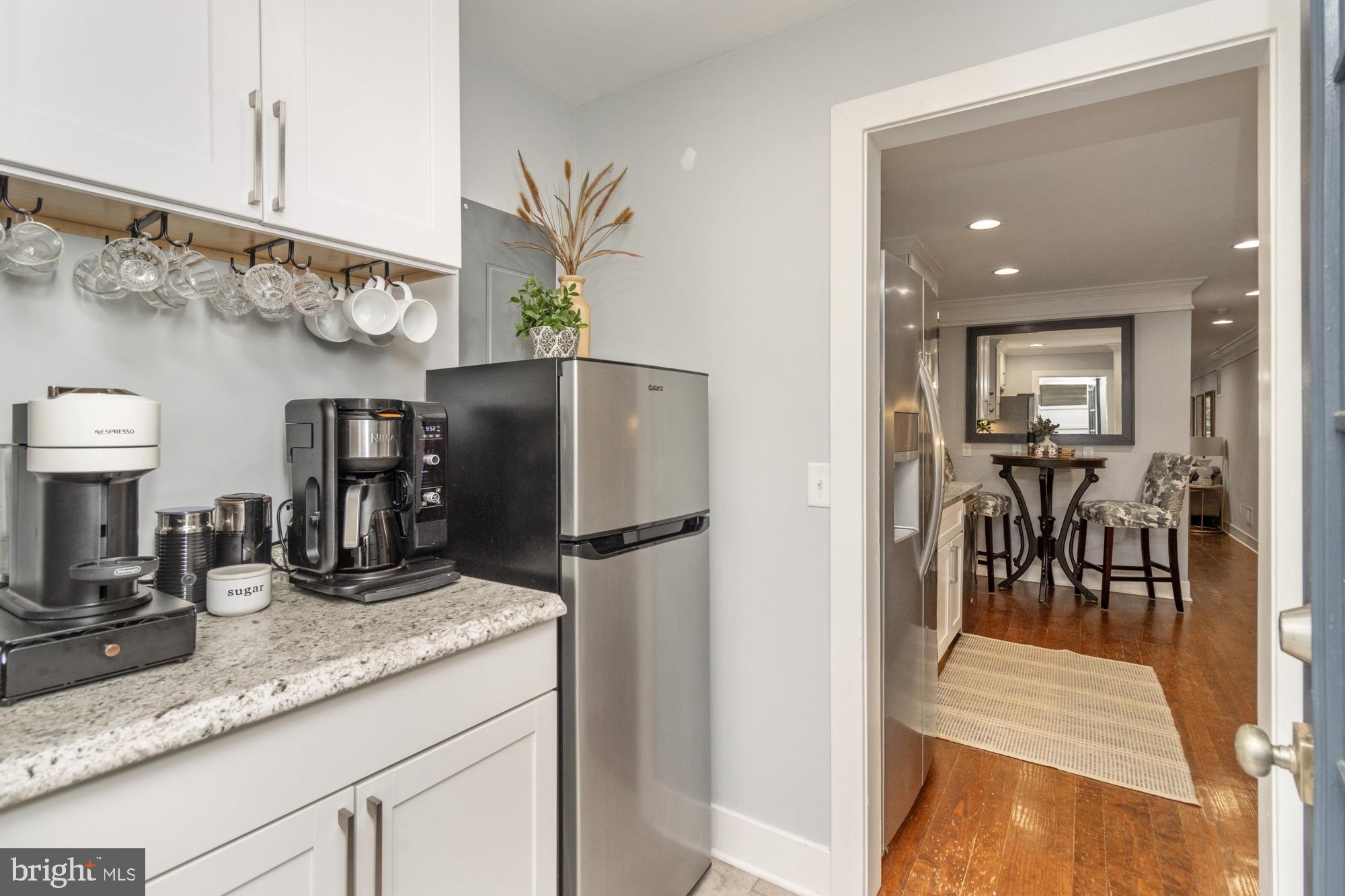 217 East Cross Street Baltimore, MD 21230 - Photo 15 of 50 a kitchen with stainless steel appliances granite countertop a refrigerator and a sink