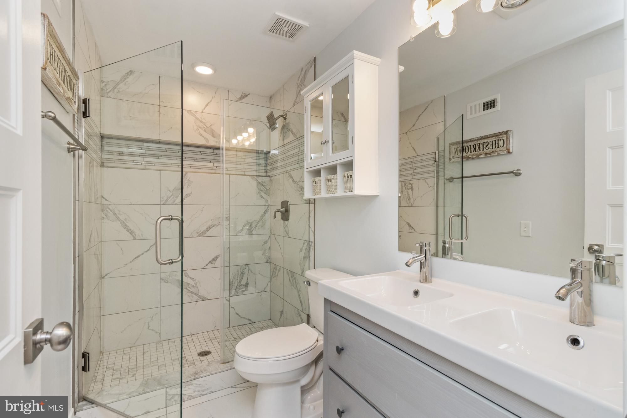 217 East Cross Street Baltimore, MD 21230 - Photo 25 of 50 a bathroom with a sink toilet and shower