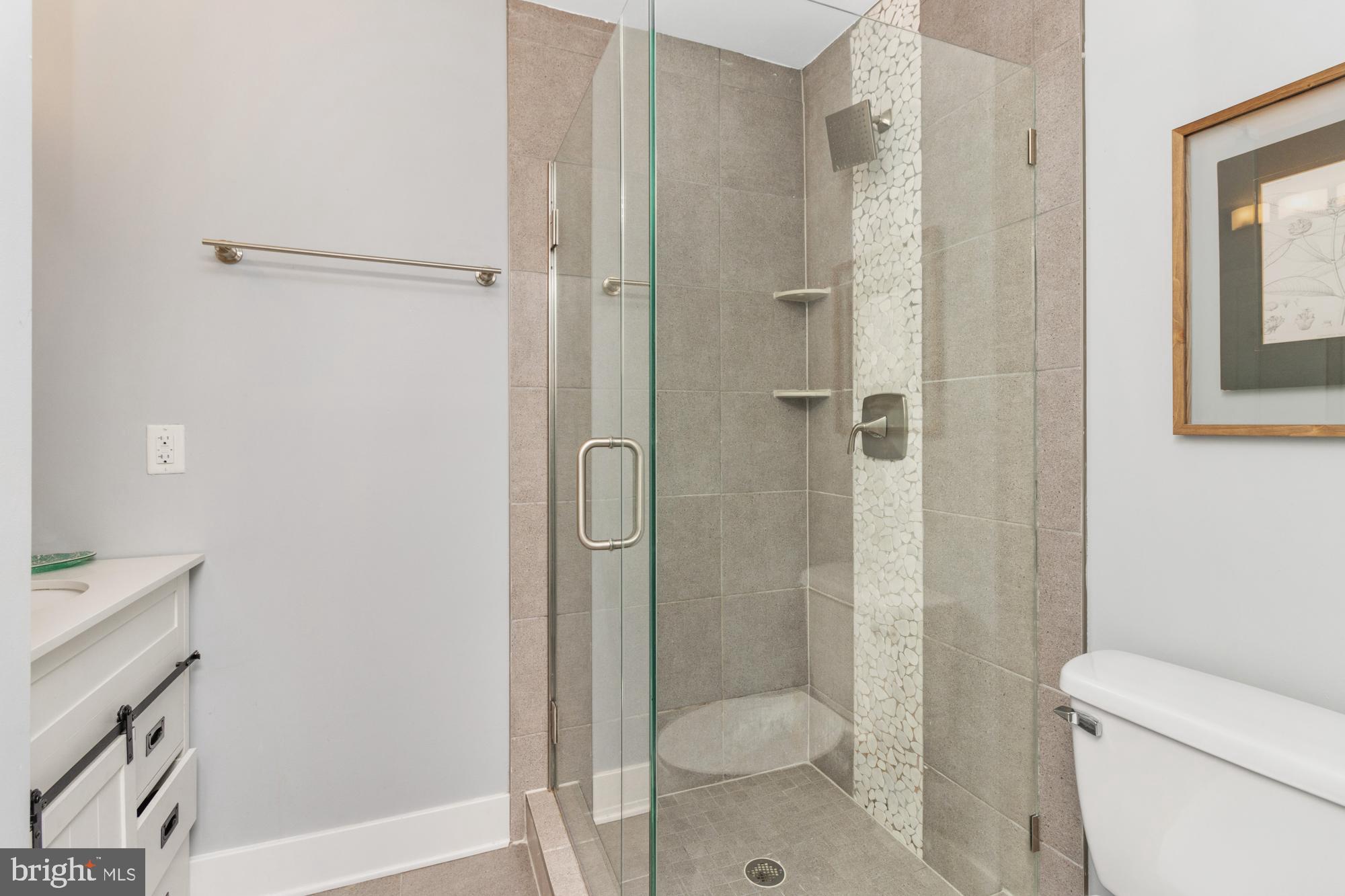217 East Cross Street Baltimore, MD 21230 - Photo 27 of 50 a bathroom with a shower toilet and sink