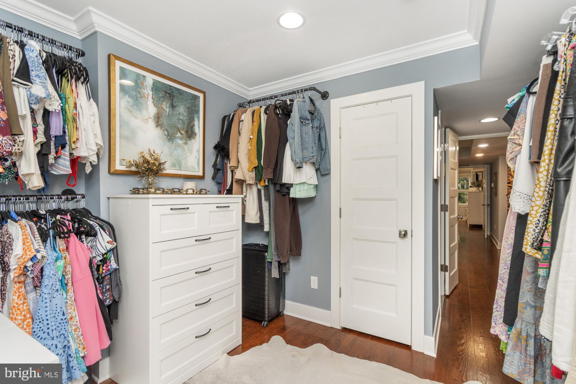 217 East Cross Street Baltimore, MD 21230 - Photo 31 of 50 a view of walk in closet with clothes and shoes
