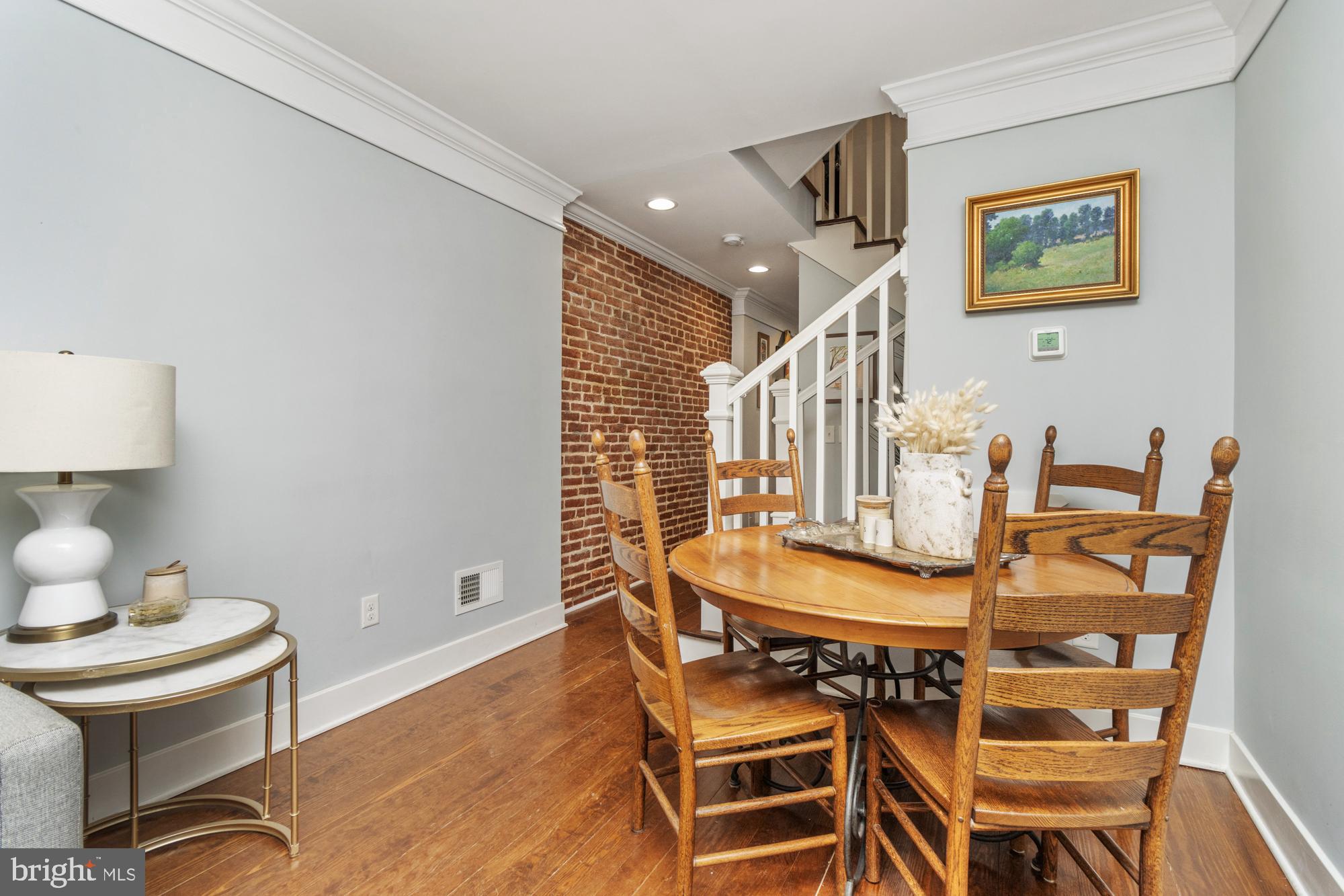 217 East Cross Street Baltimore, MD 21230 - Photo 5 of 50 a dining room with furniture and wooden floor