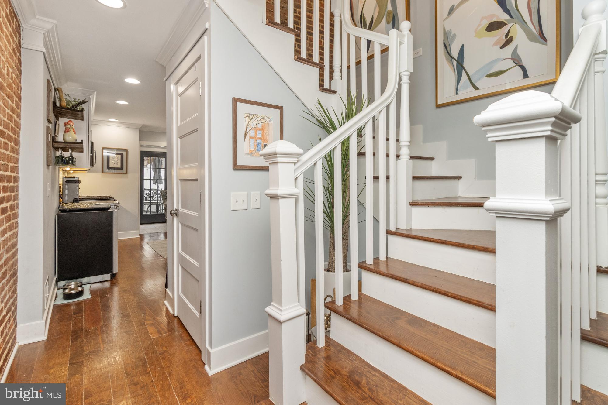 217 East Cross Street Baltimore, MD 21230 - Photo 7 of 50 a view of entryway and hall with wooden floor