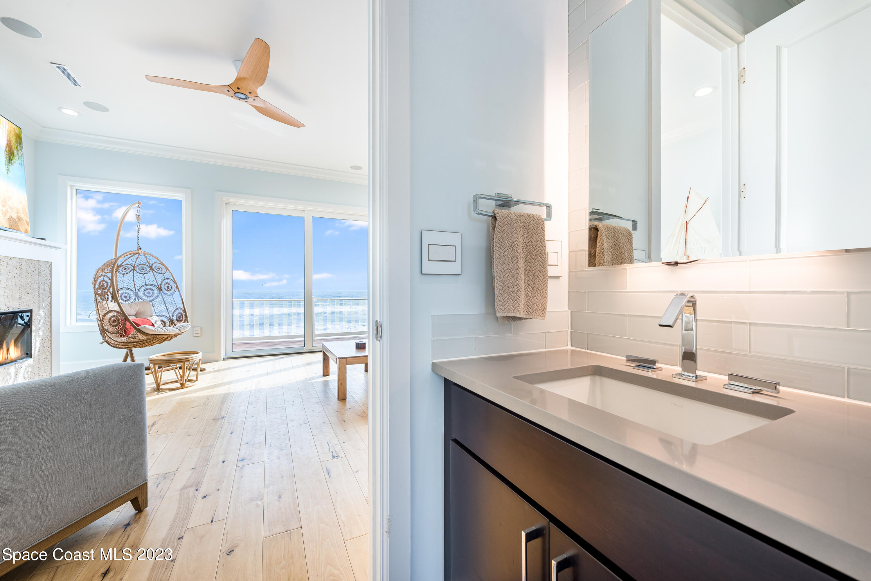795 Shell Street Satellite Beach, FL 32937 - Photo 18 of 42 a bathroom with a sink double vanity and a mirror