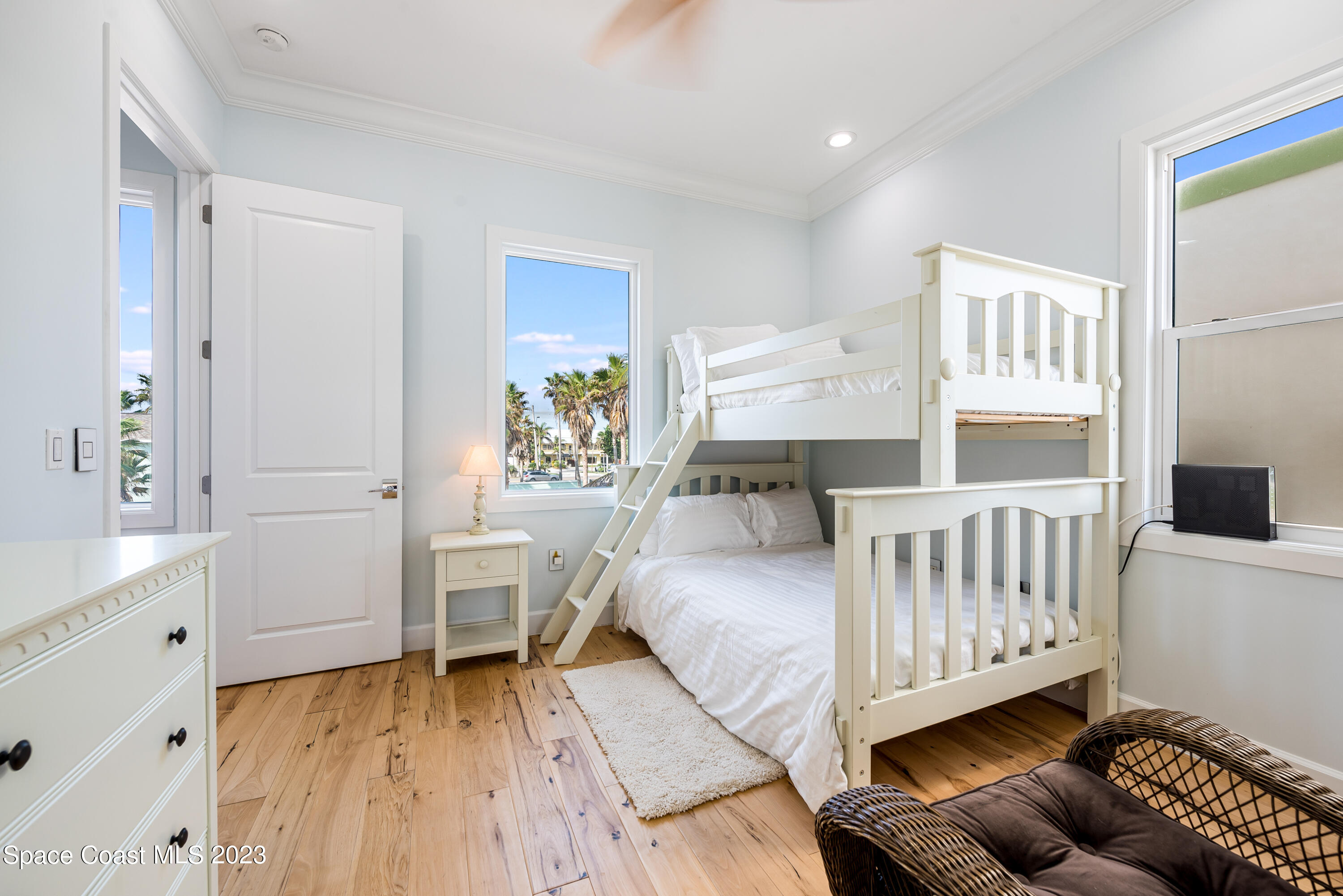 795 Shell Street Satellite Beach, FL 32937 - Photo 20 of 42 a bedroom with a bed and a chair