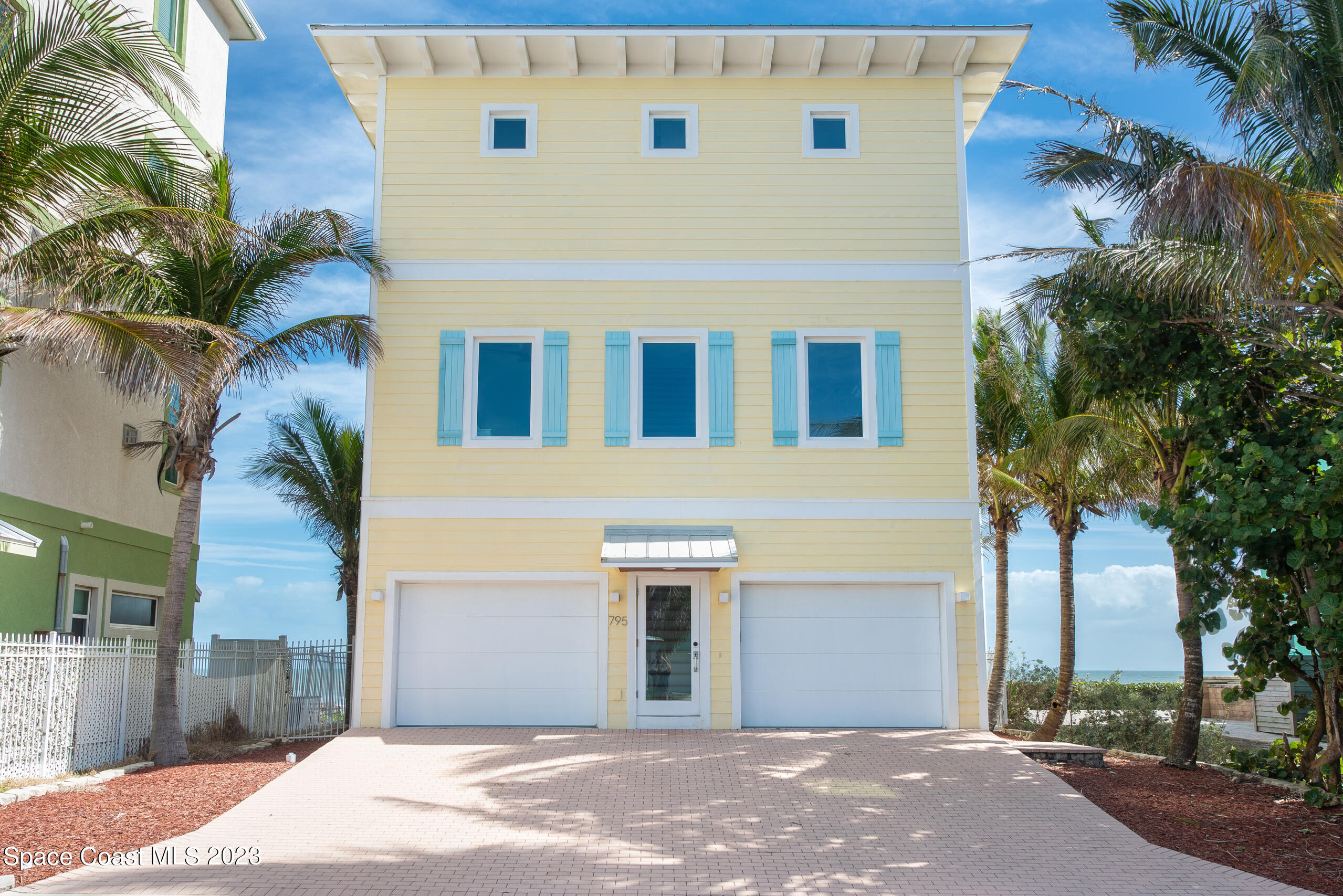 795 Shell Street Satellite Beach, FL 32937 - Photo 2 of 42 a front view of a house with a yard