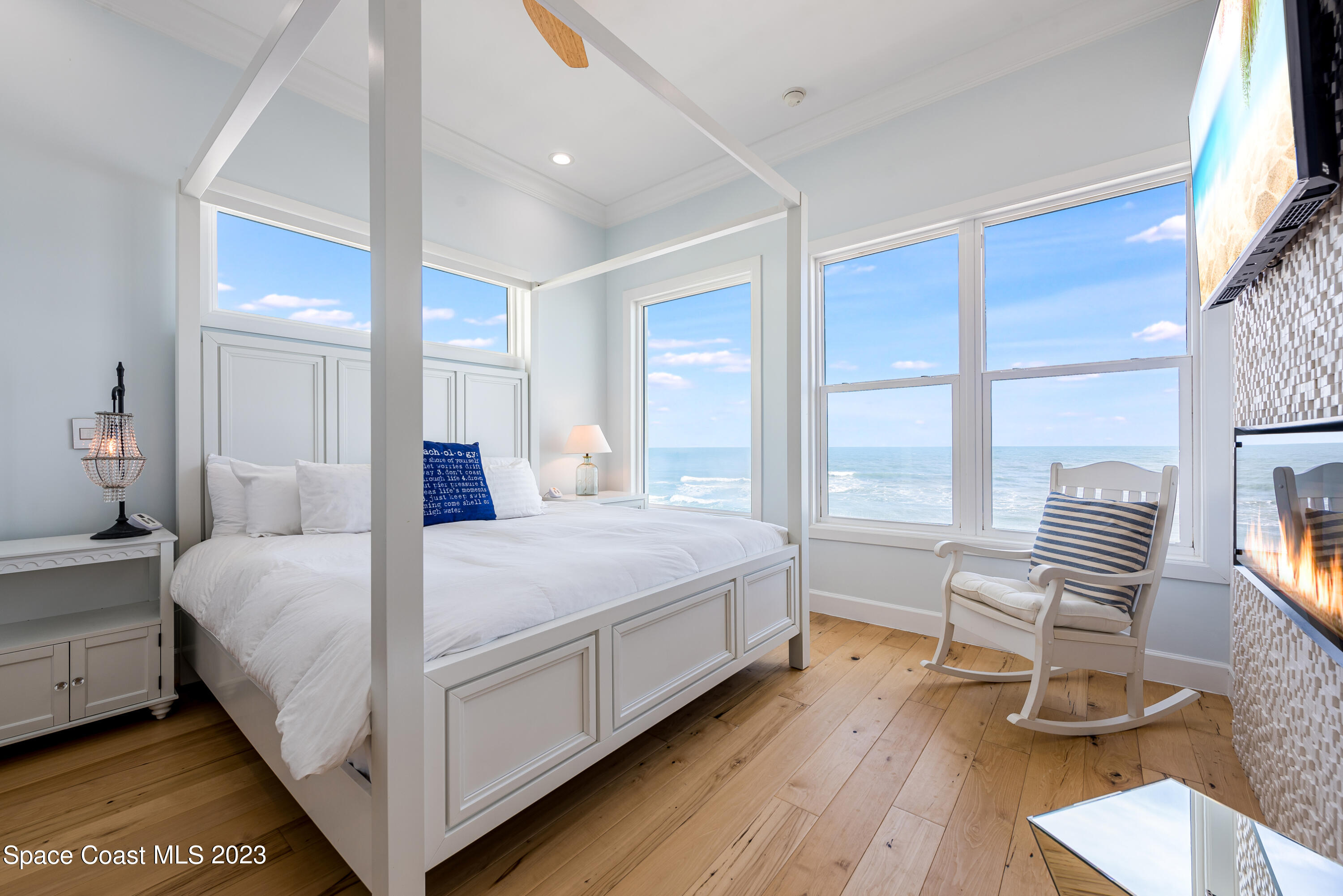 795 Shell Street Satellite Beach, FL 32937 - Photo 22 of 42 a bedroom with a bed and a chair