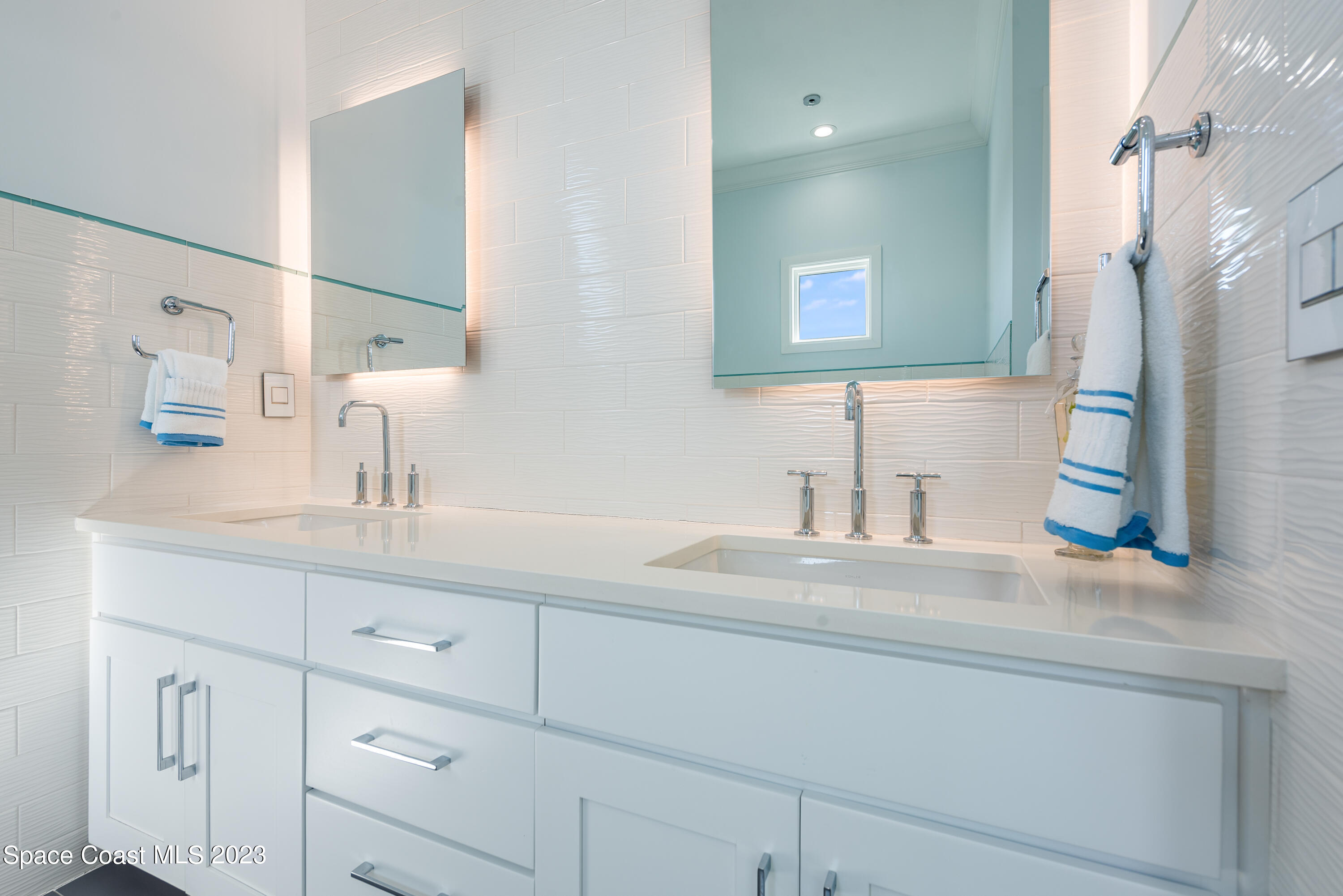 795 Shell Street Satellite Beach, FL 32937 - Photo 29 of 42 a bathroom with a sink and a mirror