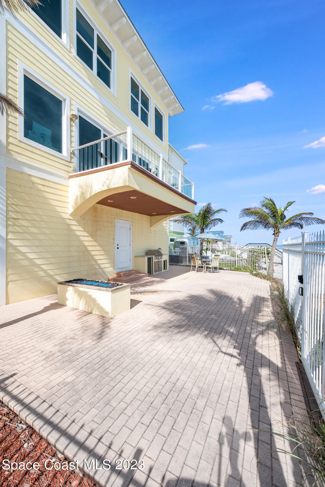795 Shell Street Satellite Beach, FL 32937 - Photo 33 of 42 a view of a building with many windows