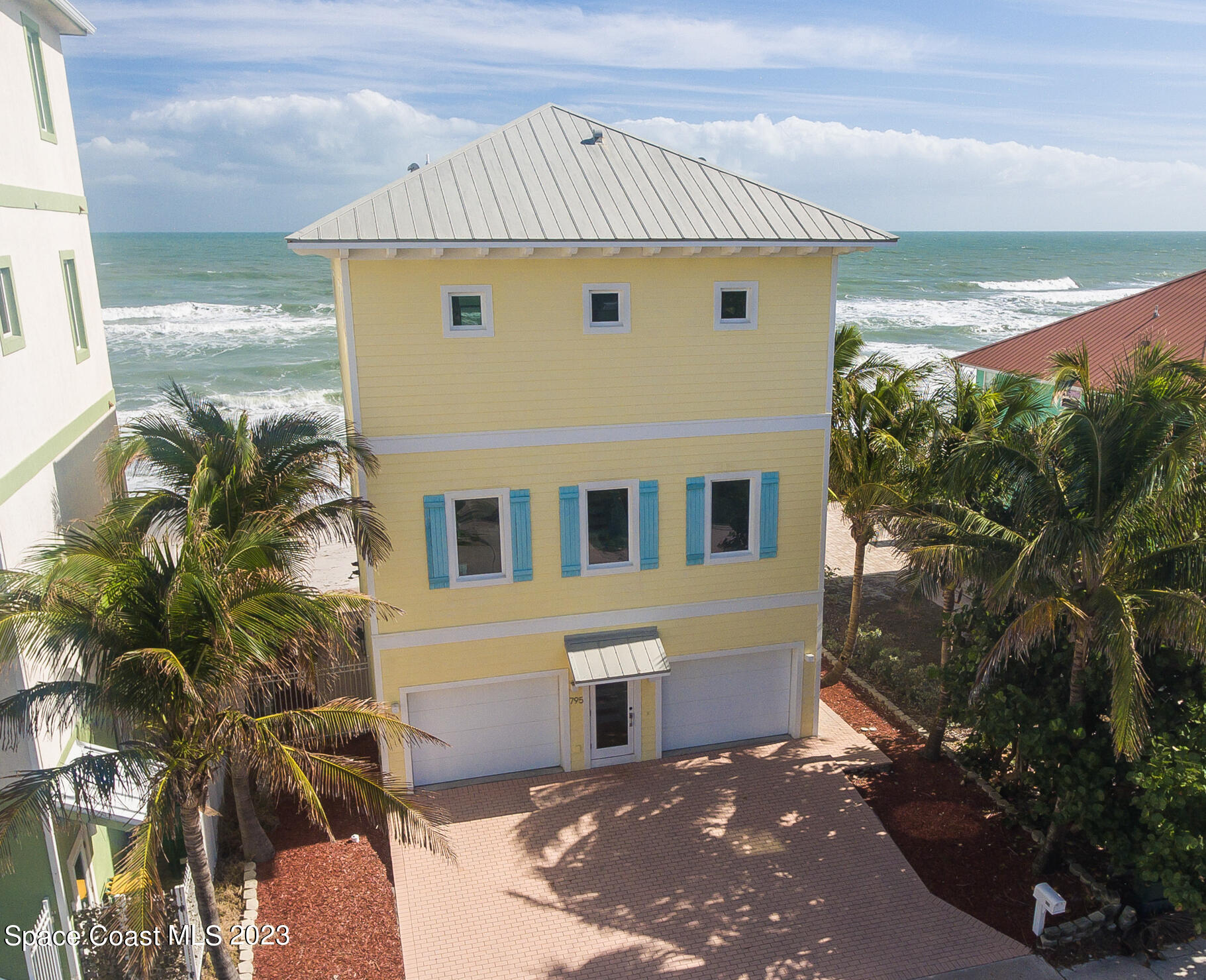 795 Shell Street Satellite Beach, FL 32937 - Photo 39 of 42 a front view of a house with a yard