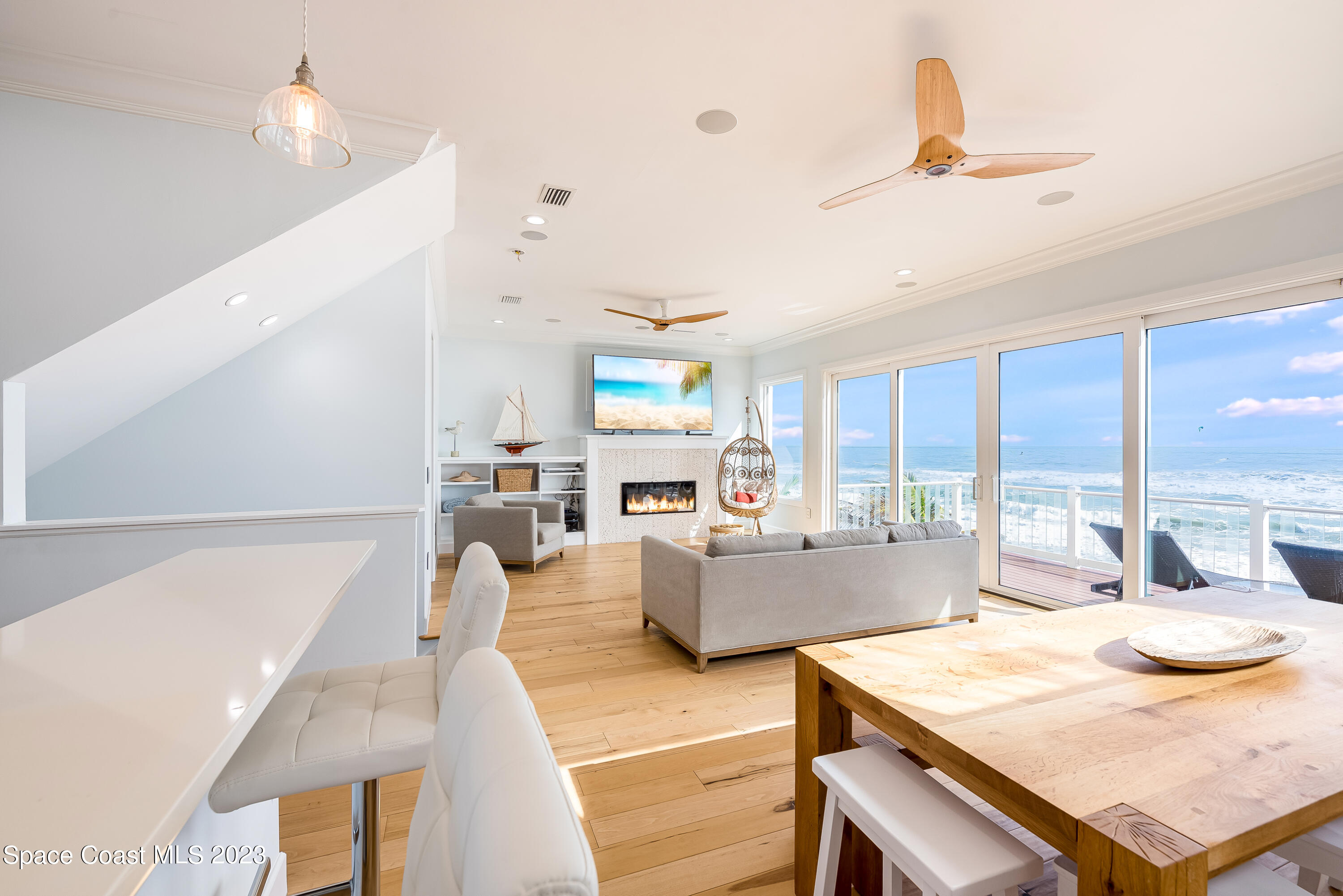 795 Shell Street Satellite Beach, FL 32937 - Photo 9 of 42 a living room with furniture kitchen view and a wooden floor