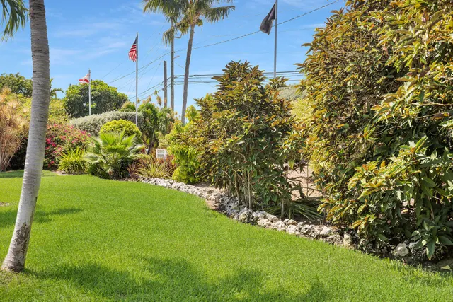 a view of a backyard patio and swimming pool