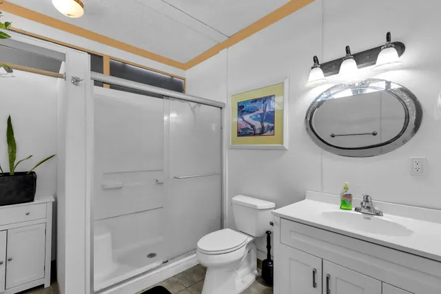 a view of washer and dryer with kitchen in the background