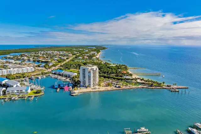 a view of a chairs and table on the wooden deck