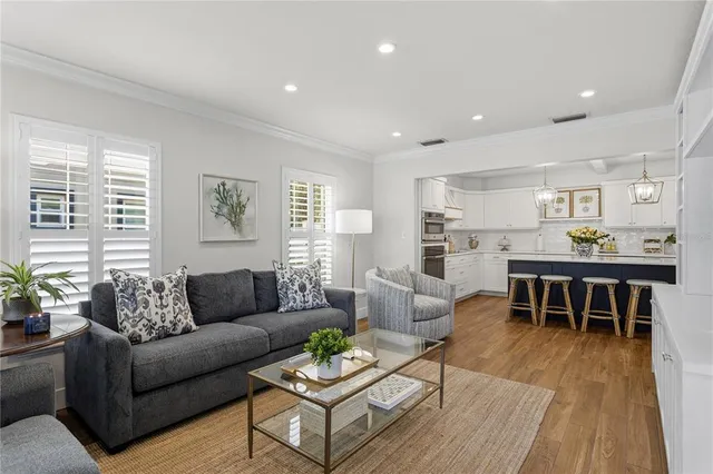 a kitchen with a sink stainless steel appliances and cabinets