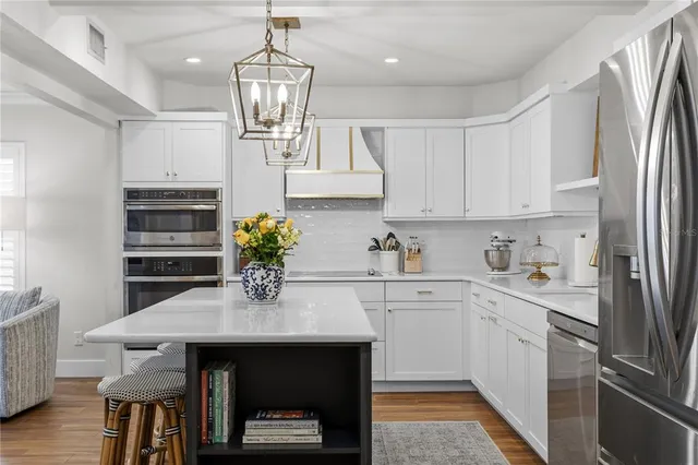 a kitchen with appliances and cabinets