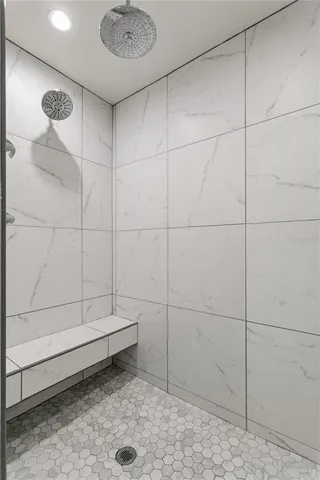 a bathroom with a toilet a sink and a mirror