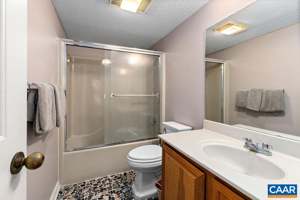 2025 Stone Ridge Wintergreen, VA 22967 - Photo 13 of 23 a bathroom with a sink toilet and shower