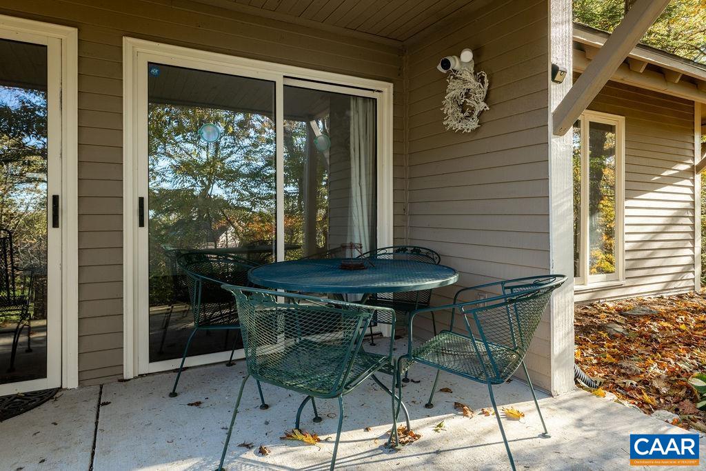 2025 Stone Ridge Wintergreen, VA 22967 - Photo 23 of 23 a view of balcony with wooden floor and outdoor seating