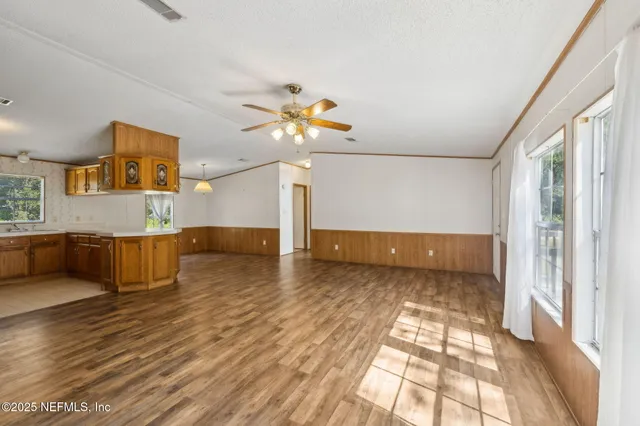 a view of a living room a couch and a chandelier