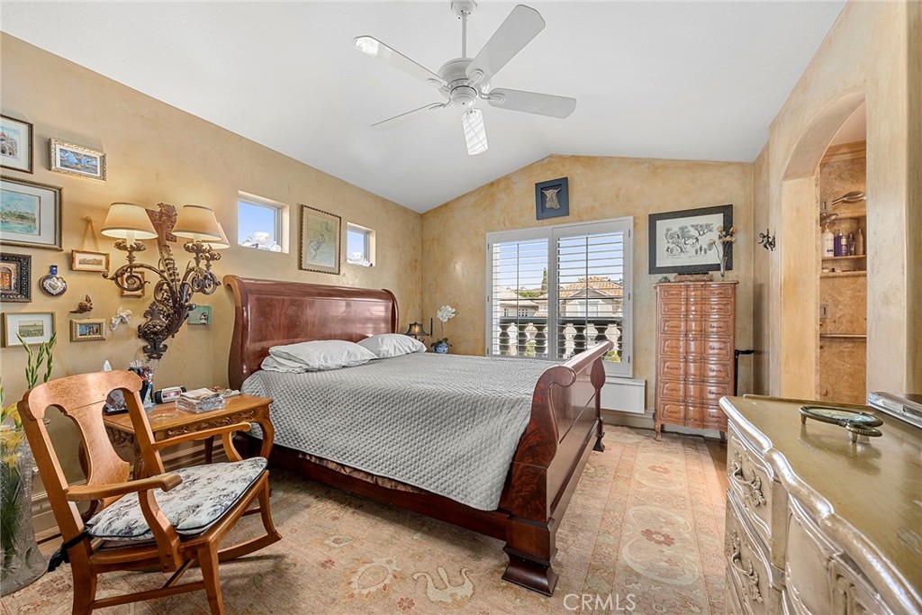 5 Monaco Dana Point, CA 92629 - Photo 12 of 19 a bedroom with a bed chairs and a large window