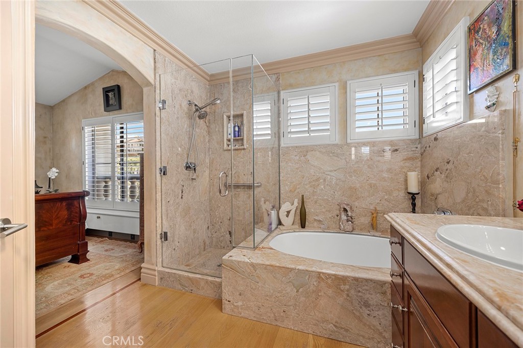 5 Monaco Dana Point, CA 92629 - Photo 13 of 19 a spacious bathroom with a granite countertop sink a toilet a glass door shower and a mirror