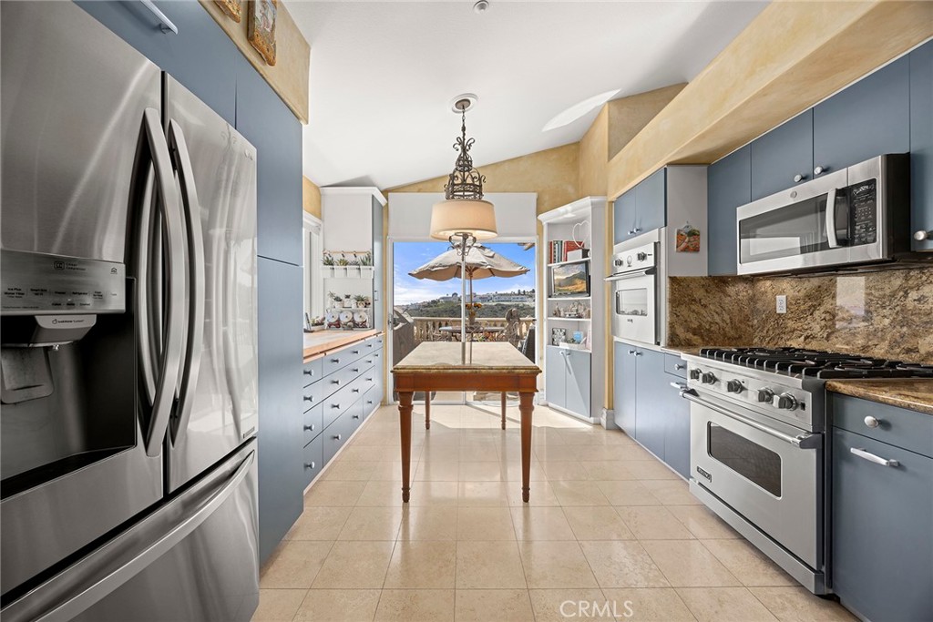 5 Monaco Dana Point, CA 92629 - Photo 7 of 19 a kitchen with stainless steel appliances a stove a microwave and a refrigerator