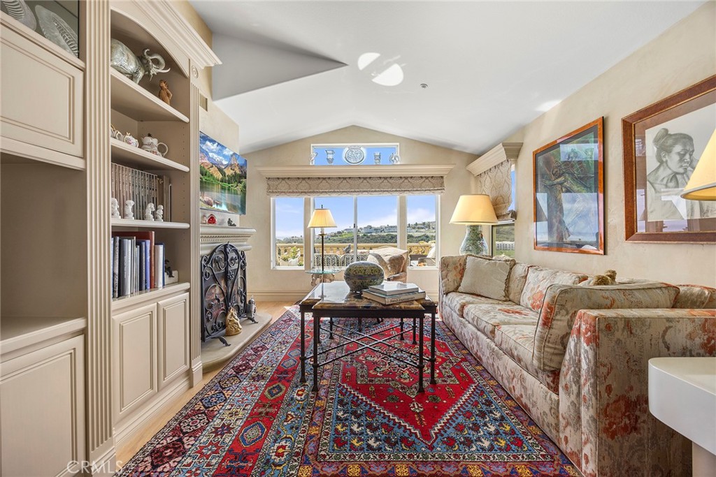 5 Monaco Dana Point, CA 92629 - Photo 10 of 19 a living room with furniture and a book shelf