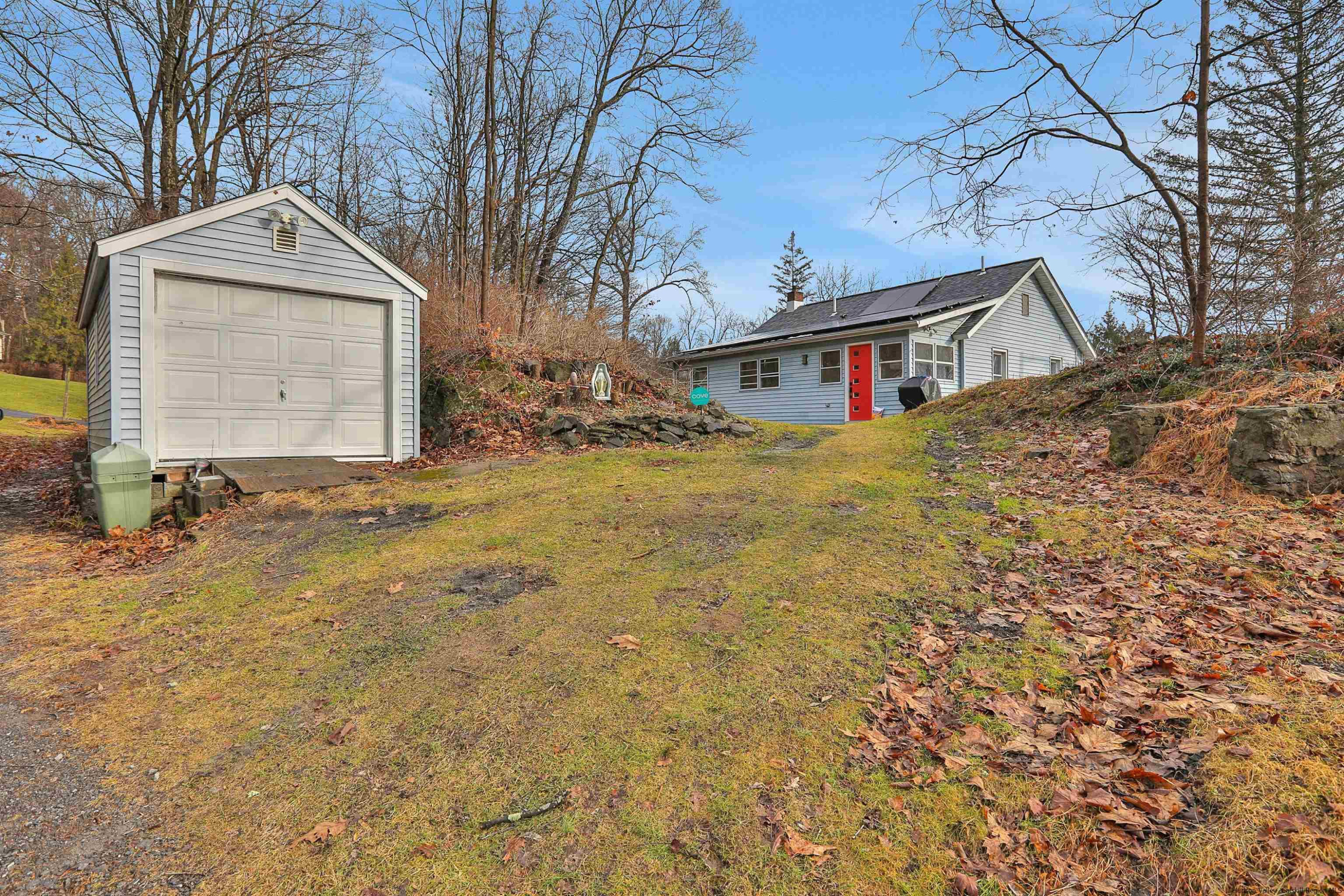 1041 Creek Locks Road Rosendale, NY 12472 - Photo 3 of 35 a front view of a house with a yard